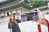 SK Telecom's Changdeok ARirang app allows visitors to take augmented reality (AR) photos with 3-D figures in the palace. [SK TELECOM]
