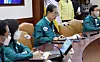 Prime Minister Han Duck-soo presides over a Covid-19 Central Headquarters meeting held at the Seoul Government Complex on the Dec. 23. [YONHAP]