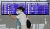 Flight attendants head to their planes at Incheon International Airport's Terminal 2 on Thursday. With the resumption of international flights, airline employees are returning to work. The leave of absence rate of Korean Air's employees stayed below 20 percent this month, according to a spokesperson from an airline. Around half of the company's employees had to take extended leaves due to the pandemic. [YONHAP]