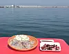 Squid dishes sold by seafood vendors in Gangwon. The left dish is raw sliced squid and the right is steamed squid. [KIM CHUN-SIK, JOONGANG PHOTO]