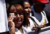 A woman reacts during a march of government supporters and relatives of Venezuelans detained in Salvadoran high-security prison for their release and return home, in Caracas, Venezuela March 25. [REUTERS/YONHAP]