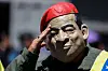 A person disguised as late Venezuelan President Hugo Chavez poses for a picture during a march in support of Venezuelan migrants deported from the United States to El Salvador in Caracas on March 25. [AFP/YONHAP]