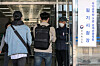 Applicants enter a test center for the grade 9 civil service exam in Dongjak District, southern Seoul, on April 22, 2022. [NEWS1]