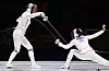 Choi In-jeong, left, and Song Se-ra compete in the women's epee final at the Hangzhou Asian games at Hangzhou Dianzi University Gymnasium in Hangzhou, China on Sunday. [YONHAP]
