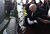 People Power Party's innovation committee head Ihn Yo-han, John Linton, kneels in front of the tomb of people still missing during the Gwangju Uprising in 1980 at the memorial in Gwangju on Monday. {YONHAP]