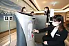 An employee at the five-star Daegu Marriott Hotel, which officially opened on Jan. 9, places water and shower products on a robot. According to KT, the newly opened hotel uses robots and runs on its artificial intelligence system. [KT]