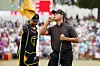 Kim Si-woo silences the crowd after making a putt on the 15th green as caddie Manuel Villegas looks on during Sunday singles matches on day four of the 2022 Presidents Cup at Quail Hollow Country Club on Sept. 25, 2022 in Charlotte, North Carolina. [GETTY IMAGES]