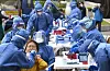 Officials at the Bupyeong District Office in Incheon get tested for the coronavirus Tuesday at a makeshift testing center on the office's front yard. The district office closed in the morning after two infections were detected among its employees. [NEWS1]