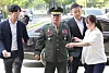 Marine Corps Commandant Lt. Gen. Kim Kye-hwan, center, appears at the Corruption Investigation Office for High-ranking Officials in Gwacheon, Gyeonggi, on Saturday, for questioning over an alleged influence-peddling case related to the death of a young Marine last year. [NEWS1]