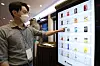 An employee demonstrates a digital vending machine during an invention event organized by the Korean Intellectual Property Office and the Korea Invention Promotion Association at the 63 Convention Center in Seoul on Monday. [NEWS1]
