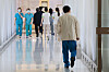 Medical professionals walk inside a general hospital located in Seoul on Thursday, amid a prolonged standoff between doctors and the government. The impasse was caused by a governmental decision to hike admission quota at medical colleges by 2,000 seats starting next year, and medical professors will decide whether to resign en masse Friday. [YONHAP]