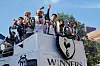 Tottemham Hotspur players wave to fans during the open-top bus parade on May 23. [YONHAP]