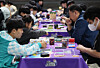 Participants compete in the 2026 Korean League Season 1 Pokémon Card Game tournament at Coex in Gangnam District, southern Seoul, on Nov. 30. [YONHAP]