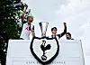 Tottenham Hotspur's Son Heung-min, center, holds the Europa League trophy as he stands with Tottenham Hotspur's Richarlison during an open-top bus parade on May 23. [AFP/YONHAP]