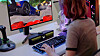 A model plays games using LG Electronics' new LG UltraGear gaming speakers released on Monday. The new speaker model has internally installed microphones that allow gamers to communicate without wearing a separate set of microphones. [LG ELECTRONICS]
