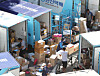 Delivery workers sort packages at a logistic center in Seoul. [NEWS1]