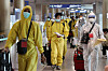 Passengers wearing protective gear arrive at Incheon International Airport on Monday as health authorities imposed an entry ban on foreign arrivals from eight African countries, including South Africa, to block the new Covid-19 variant Omicron. [YONHAP]