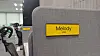 An employee's English name written above their Korean one on a desk divider at KakaoBank [KAKAOBANK]