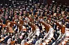 Ruling Democratic Party lawmakers cheer while the People Power Party members shout out their protests as the National Assembly passes a controversial bill Thursday revising the Corruption Investigation Office for High-ranking Officials (CIO) law to remove the veto power of the main opposition party in the process of selecting the CIO chief. [YONHAP]