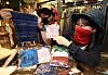Customers examine scarves that can be used to cover their faces at Lotte Department Store's Daegu branch on Wednesday. On-year sales of multi-use scarves increased by 30 percent in May, as consumers seek protection from UV rays and airborne pathogens. [YONHAP]