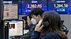 Electronic display boards at Hana Bank in central Seoul show stock and foreign exchange markets on Wednesday morning. [YONHAP]