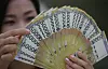 Piles of 50,000 won note at a bank in Korea. The Korean government has continued to collect more taxes in the first seven months compared to the same period a year ago. But spending have been larger as Covid-19 continues. [YONHAP]