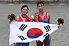 Bronze medalist Kim Ha-yeong and Lee Soo-bin of Korea pose during the medal ceremony for the women's pair rowing event during the Asian Games in Hangzhou, China on Monday. [AFP/YONHAP]