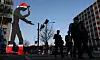 The Hammering Man sculpture in front of the Heungkuk Life Insurance building in Jongno District, central Seoul, is seen with Christmas accessories on Monday. The Hammering Man, which celebrates its 20th anniversary this year, is being decorated as part of the 'Happy New Year Hammering Man' project. [YONHAP]