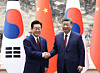 President Lee Jae Myung, left, shakes hands with Chinese President Xi Jinping during their bilateral summit at the Great Hall of the People in Beijing on Jan. 5. [JOINT PRESS CORPS]