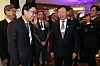 Busan Mayor Park Heong-joon, left, and Lotte Group Chairman Shin Dong-bin, second from right, speak with each other during the Korea Night 2023 event held in Davos, Switzerland, on Wednesday. Samsung Electronics Executive Chairman Lee Jae-yong, far right, and HD Hyundai CEO Chung Ki-sun, center, are shown in the background. [YONHAP]