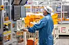 An employee inspects the battery production process at LG Energy Solution's plant in Holland, Michigan. [LG]