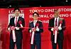 From left, Shin Yoo-yeol, executive director of the Future Growth Office at Lotte Corporation; Lotte Duty Free CEO Kim Ju-nam; and Lotte Holdings CEO Genichi Tamatsuka hold a ribbon-cutting at the renewal opening ceremony for Lotte Duty Free's store in Tokyo's Ginza district on Wednesday morning. [LOTTE DUTY FREE]