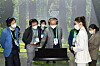 SK Innovation Vice Chairman Kim Jun, third from left, visits the company's booth at CES 2022. [SK INNOVATION]