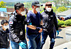 Police escort a Chinese man apprehended Wednesday who is accused of sneaking into Korea on a motorboat with six others last week. [YONHAP]