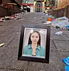A photo of Yuliana Pak, one of the four Russian victims of the Itaewon tragedy, is placed on the site of the crowd crush in Itaewon, central Seoul, on Tuesday. [YULIANA PAK'S FAMILY]