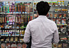Despite the convenience store market being saturated in Korea, it is also one of the only offline retail sectors that has seen significant sales growth in recent years. Pictured is a customer looking at items displayed at a convenience store in Seoul on Oct. 23, 2024. [NEWS1]