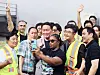 SK Group Chairman Chey Tae-won, third from left, takes a selfie with Absolics staff at its headquarters in Georgia on July 3. [SK GROUP]