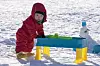 A child stands on the snowy ground of Snowyland at Vivladi Park in Hongcheon County, Gangwon. [VIVALDI PARK]