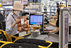 A customer buys groceries at a supermarket in Seoul on May 23. [NEWS1]