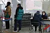 People wait in line to get tested for Covid-19 at a testing center in Mapo District, western Seoul, on Dec. 26. [YONHAP]