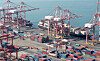 Shipping containers are stacked at a port in Busan on Feb. 26 [YONHAP]