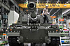 A Korean engineer works on a K-9 self propelled howitzer at Hanwha Aerospace factory in Changwon on September 15, 2023. [AFP/YONHAP]