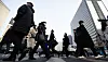 People walk toward their offices in central Seoul on Tuesday, a day after the Lunar New Year holiday. [NEWS1]