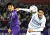 The Suwon Samsung Bluewings' Yang Sang-min, right, and FC Anyang's Hong Chang-beom vie for the ball during the first leg of the K League promotion-relegation playoffs held at Anyang Sports Complex in Anyang, Gyeonggi on Wednesday. [NEWS1]