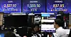 A screen in Hana Bank's trading room in central Seoul shows stock and foreign exchange markets open on Friday. [NEWS1]