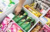 A person reaches into an ice cream freezer at a convenience store in Seoul. [NEWS1]