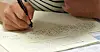 A test taker marks answers for the TOPIK test [JOONGANG ILBO]