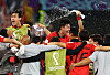 Son Heung-min celebrates with his teammates and coaching staff celebrate after beating Portugal 2-1 and qualifying for the knockout stages of the 2022 World Cup on Friday evening at the Education City Stadium in Al-Rayyan, west of Doha. [REUTERS/YONHAP]