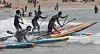 Surfers compete in the 2021 Busan Mayor’s Cup International Surfing Championship off Songjeong Beach in Busan on Sunday. Around 400 surfers competed. [SONG BONG-GEUN]