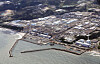 An aerial view of the ruined Fukushima Daiichi nuclear power plant in eastern Japan on Thursday, the first day that the Tokyo Electric Power Company began releasing radioactive water used to cool the melted nuclear reactor into the Pacific Ocean. [YONHAP/KYODO]